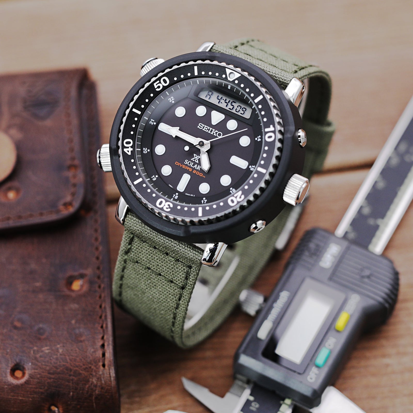 Seiko Prospex Arnie Re-Issue Solar Hybrid Black LCD Watch SNJ025P1 Strapcode Watch Bands